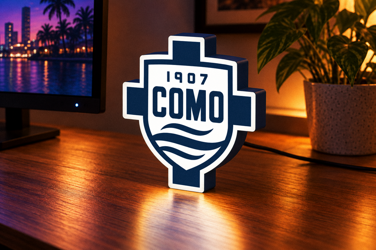 Como 1907 illuminated LED football lightbox displayed on a desk
