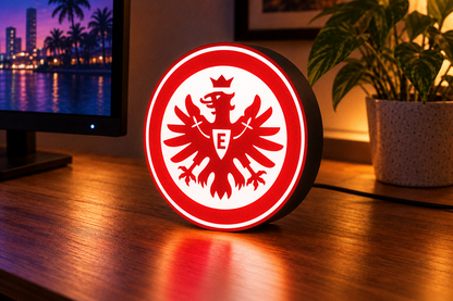 Eintracht Frankfurt red and white football crest LED lightbox displayed on a desk