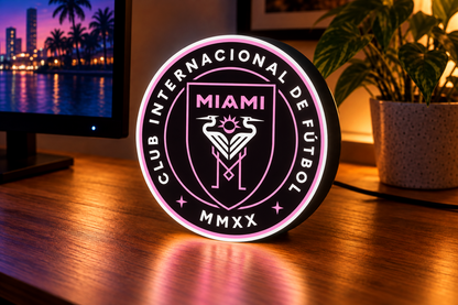 Inter Miami CF pink and white LED lightbox on a gaming desk