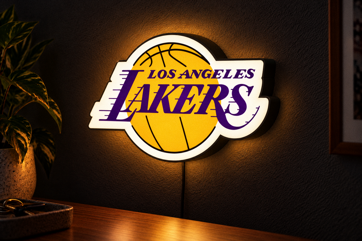 Los Angeles Lakers illuminated logo LED lightbox mounted on a dark wall