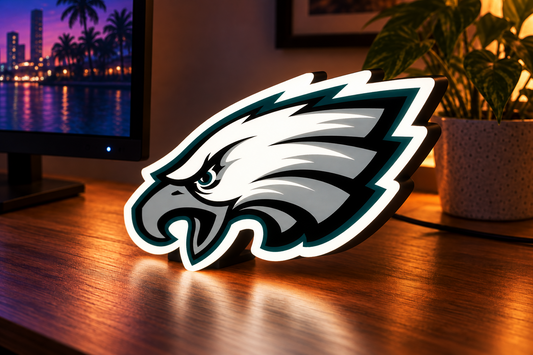 Philadelphia Eagles illuminated LED football logo lightbox standing on gaming desk