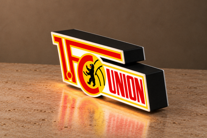 Angled side view of Union Berlin lightbox showing depth and matte dark housing